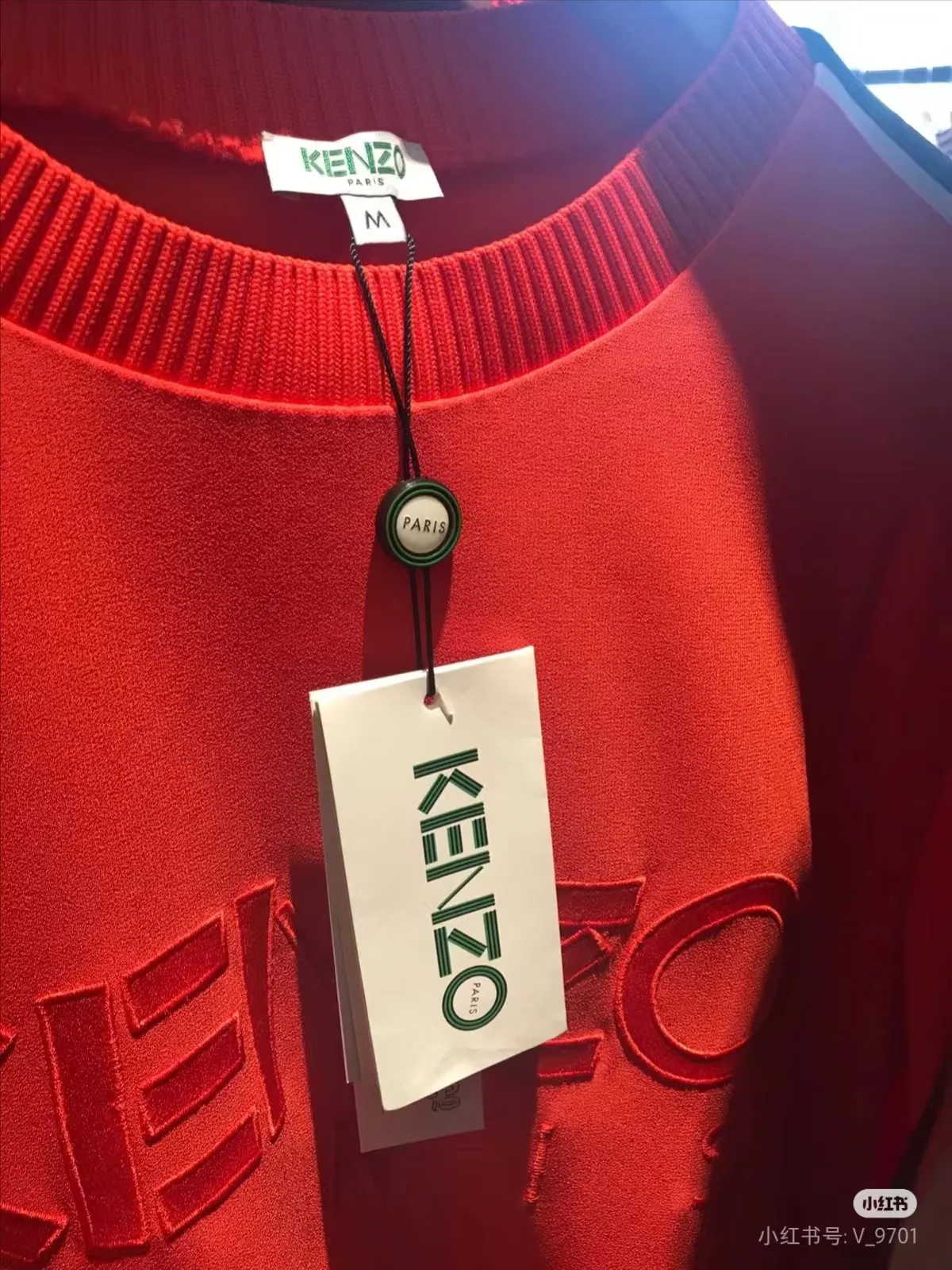Red garment with custom hang tag
